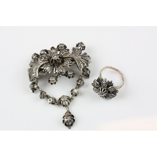 242 - Indian White Metal Brooch and Matching Ring, both profusely fashioned as floral and fauna and set wi... 