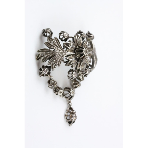 242 - Indian White Metal Brooch and Matching Ring, both profusely fashioned as floral and fauna and set wi... 