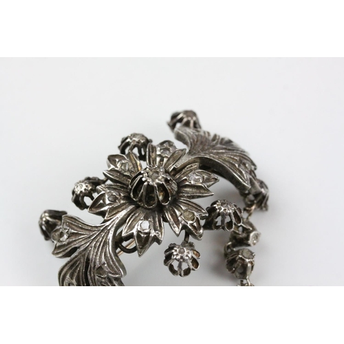 242 - Indian White Metal Brooch and Matching Ring, both profusely fashioned as floral and fauna and set wi... 