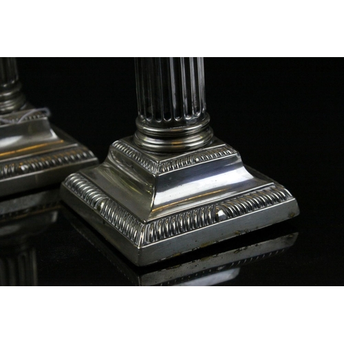 87 - Pair of Silver Plated Corinthian Column Candlesticks, h.17cms