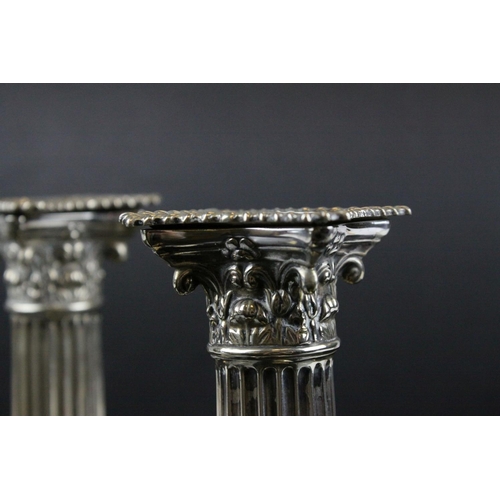 87 - Pair of Silver Plated Corinthian Column Candlesticks, h.17cms