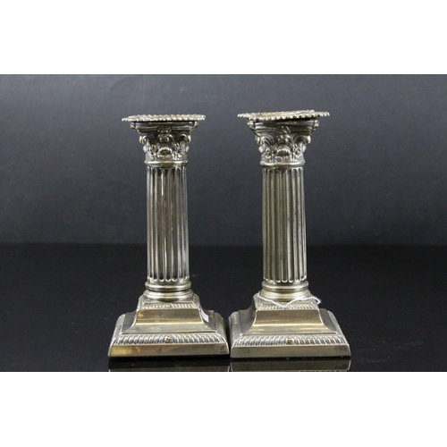 87 - Pair of Silver Plated Corinthian Column Candlesticks, h.17cms