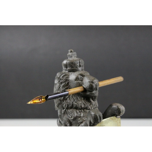 93 - 19th century Pewter Inkwell and Quill Holder in the form of a Lion sitting on his back legs and hold... 