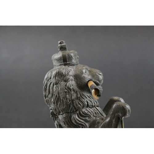 93 - 19th century Pewter Inkwell and Quill Holder in the form of a Lion sitting on his back legs and hold... 
