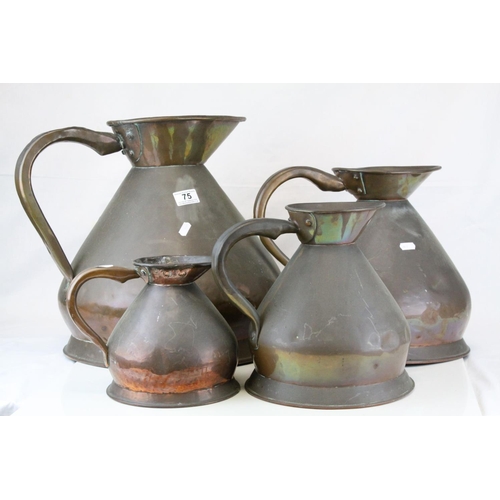 75 - Set of Four Late 19th / Early 20th century Copper Graduating Measuring Jugs, ranging from 4 gallons ... 