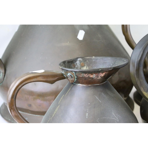 75 - Set of Four Late 19th / Early 20th century Copper Graduating Measuring Jugs, ranging from 4 gallons ... 