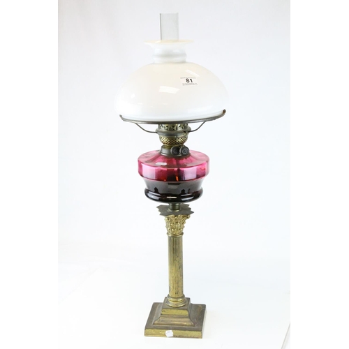 81 - Victorian Brass Corinthian Column Oil Lamp with Purple Glass Well and Opaque Glass Shade, h.76cms