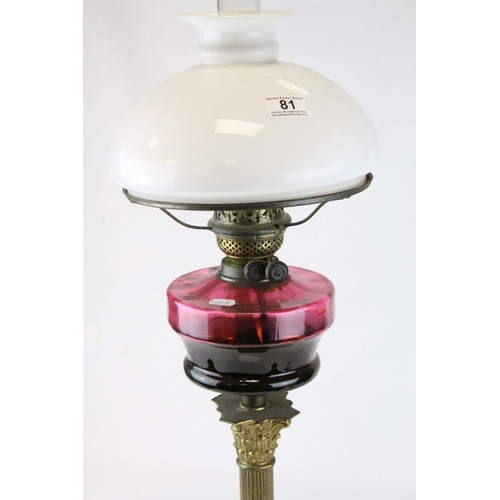 81 - Victorian Brass Corinthian Column Oil Lamp with Purple Glass Well and Opaque Glass Shade, h.76cms