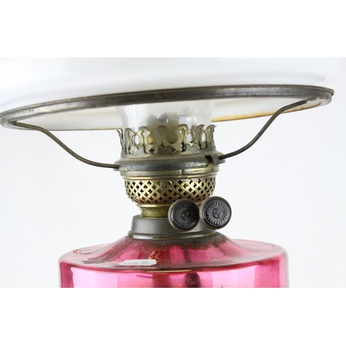 81 - Victorian Brass Corinthian Column Oil Lamp with Purple Glass Well and Opaque Glass Shade, h.76cms