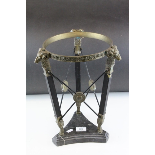 88 - Empire Style Wrought Iron and Brass Stand with Rams Head Mounts, h.38cms