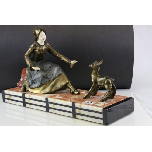 92 - Art Deco Spelter Figure Group of a Young Woman feeding a Goat, raised on a Marble, Slate and Onyx Ba... 