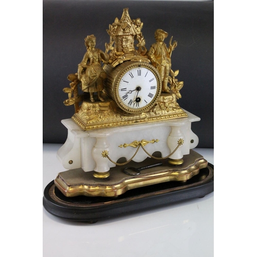 99 - 19th century Continental Ornate Gilt Metal Figural Mantle Clock raised on a White Onyx Base and cont... 