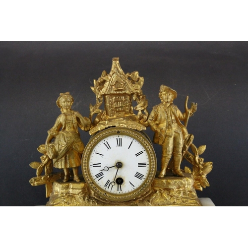 99 - 19th century Continental Ornate Gilt Metal Figural Mantle Clock raised on a White Onyx Base and cont... 