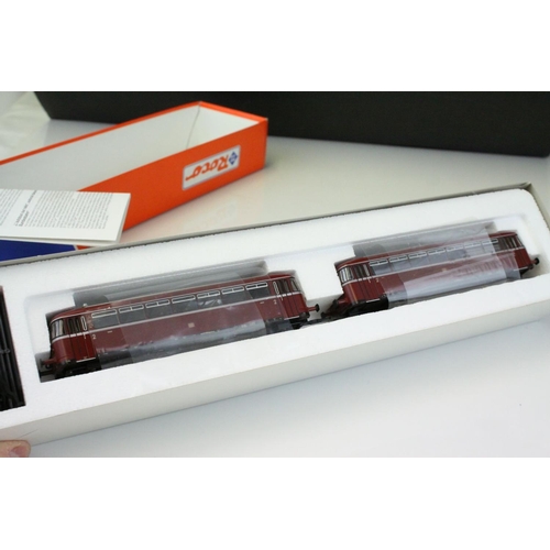 60 - Four boxed ROCO HO gauge locomotives to include International 4130 E1445 DB, 43457 DB BR290, 63640 D... 