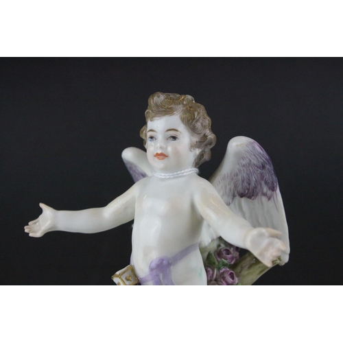 20 - Meissen Porcelain Figure of Cupid with open arms, the base decorated with gilt scrolls, blue cross s... 