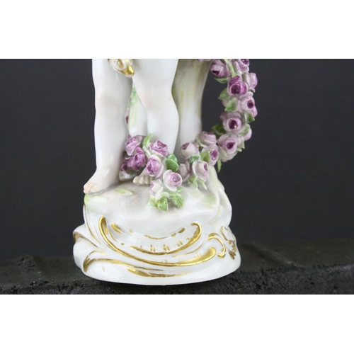 20 - Meissen Porcelain Figure of Cupid with open arms, the base decorated with gilt scrolls, blue cross s... 
