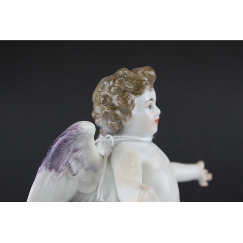 20 - Meissen Porcelain Figure of Cupid with open arms, the base decorated with gilt scrolls, blue cross s... 