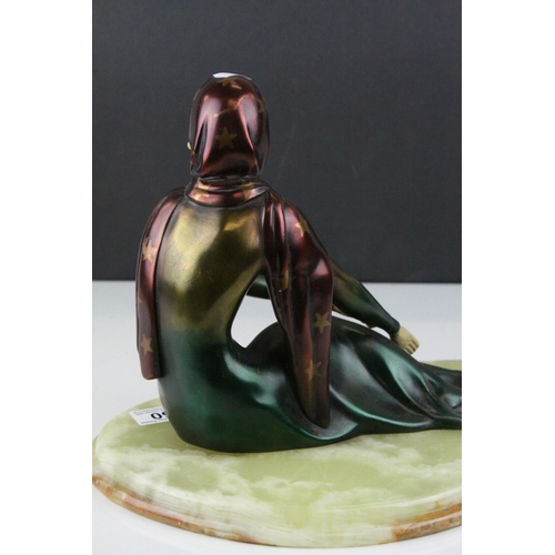 50 - In the manner of Ugo Cipriani, Art Deco style resin figure of an elegant lady in green flowing dress... 