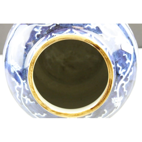 7 - Chinese Vase, the blue ground with flower decoration, 25cms high