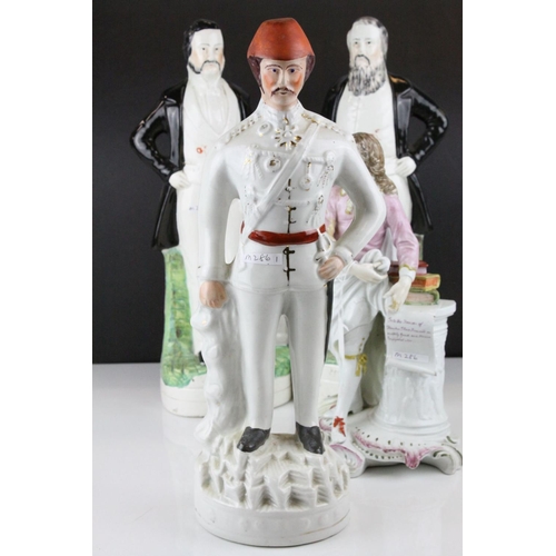8 - Three 19th century Staffordshire Figures of Sankey, Moody and General Gordon, 42cms high together wi... 