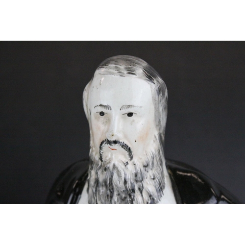 8 - Three 19th century Staffordshire Figures of Sankey, Moody and General Gordon, 42cms high together wi... 