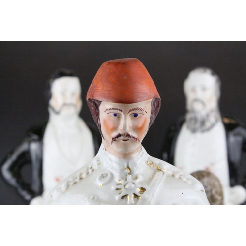 8 - Three 19th century Staffordshire Figures of Sankey, Moody and General Gordon, 42cms high together wi... 