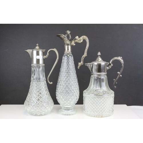 103 - Three Glass and Silver Plate Claret Jugs, Two Glass Beer Steins with Pewter Legs and a Ceramic Slop ... 