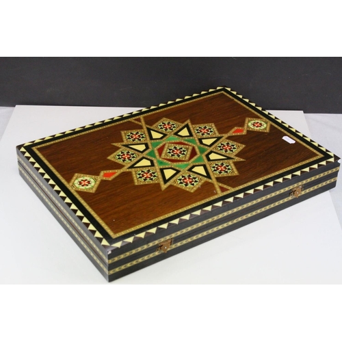 110 - Two Wooden Games Boxes inlaid with bone and mother of pearl, each containing draughts pieces and dic... 