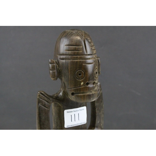 111 - African Tribal Carved Hardwood Figure of a Pensive Looking Male, 25cms high