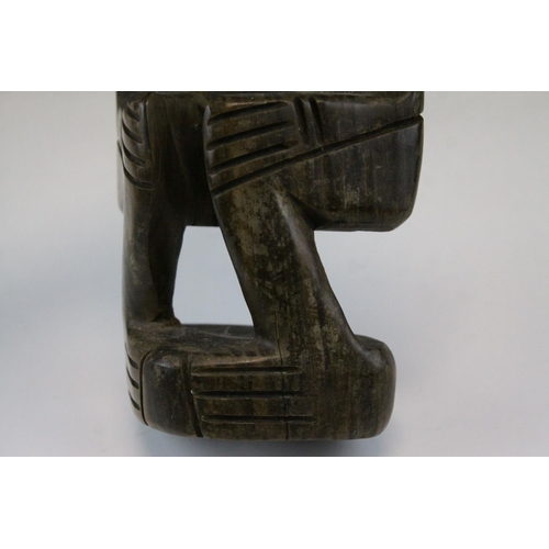 111 - African Tribal Carved Hardwood Figure of a Pensive Looking Male, 25cms high