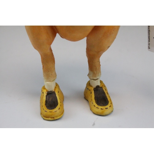 117 - Novelty Rubber Pig wearing Gloves and Shoes, 23cms high