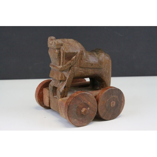120 - Carved Wooden Push-along Toy in the form of a Roman Horse, 15cms high