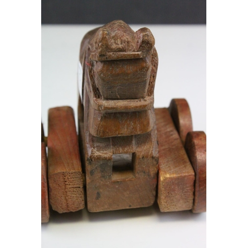 120 - Carved Wooden Push-along Toy in the form of a Roman Horse, 15cms high