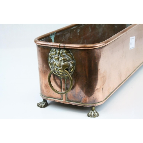 61 - Copper Rectangular Planter with Brass Ring Lion Mask Handles and Brass Paw Feet, 37cms long