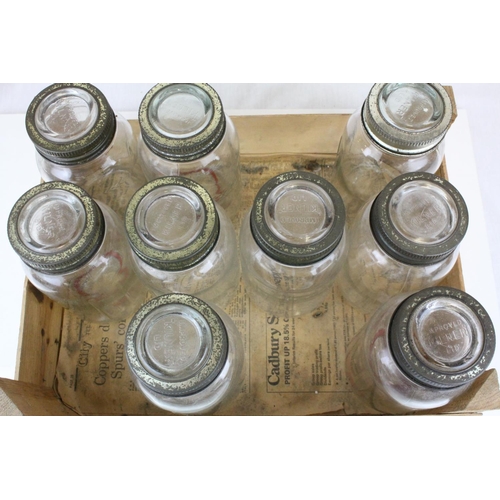 79 - Twelve Mid 20th century Kilner Jars with screw-on lids, 18cms high