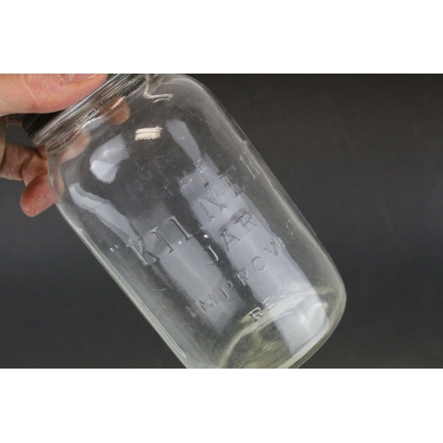 79 - Twelve Mid 20th century Kilner Jars with screw-on lids, 18cms high