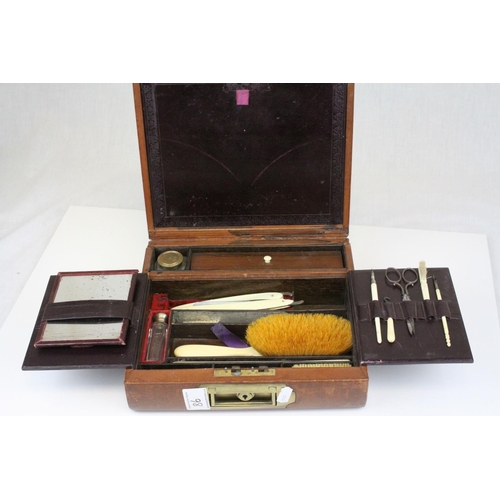 86 - Victorian Leather Covered Gentleman's Travelling Writing / Vanity Case, the hinged lid opening to re... 