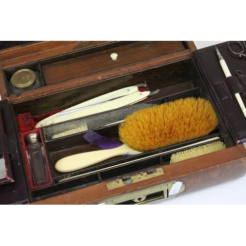 86 - Victorian Leather Covered Gentleman's Travelling Writing / Vanity Case, the hinged lid opening to re... 