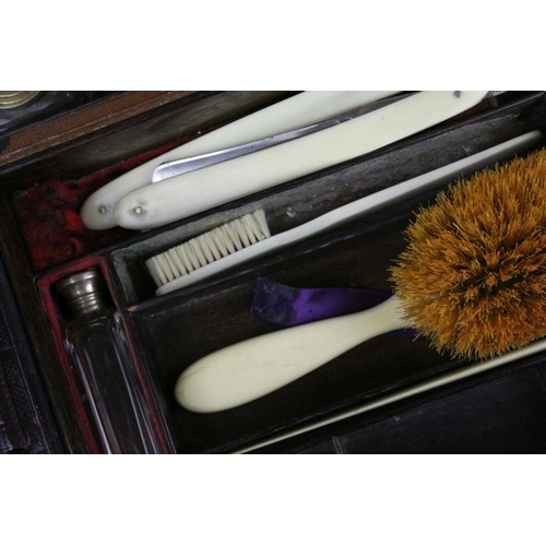 86 - Victorian Leather Covered Gentleman's Travelling Writing / Vanity Case, the hinged lid opening to re... 