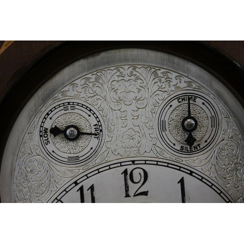 97 - Edwardian Mahogany Inlaid Arched Top Three Train Mantle Clock, the engraved white metal face with Fa... 