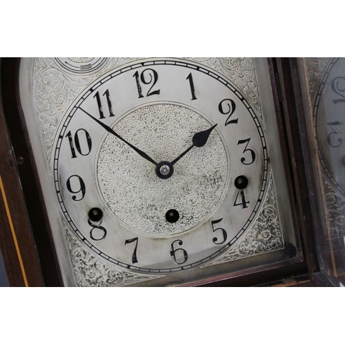 97 - Edwardian Mahogany Inlaid Arched Top Three Train Mantle Clock, the engraved white metal face with Fa... 