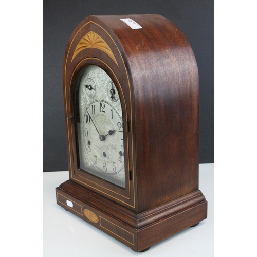 97 - Edwardian Mahogany Inlaid Arched Top Three Train Mantle Clock, the engraved white metal face with Fa... 