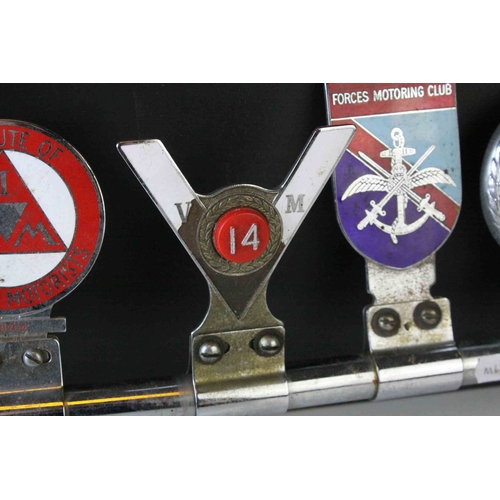 103 - Seven Vintage Car Badges mounted on Tubular Bracket including Singapore AA Badge, Notts & County... 