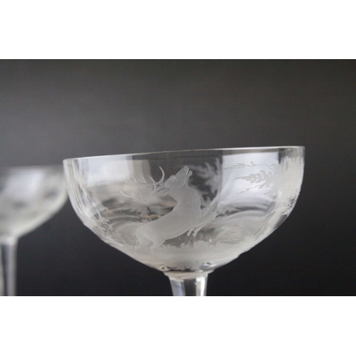 128 - Five Glass Champagne Coups / Cups, each bowl etched with a scene of Stags in Woodland, 18cms high