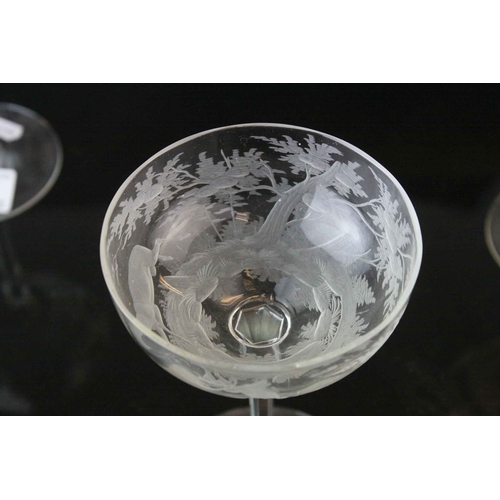 128 - Five Glass Champagne Coups / Cups, each bowl etched with a scene of Stags in Woodland, 18cms high