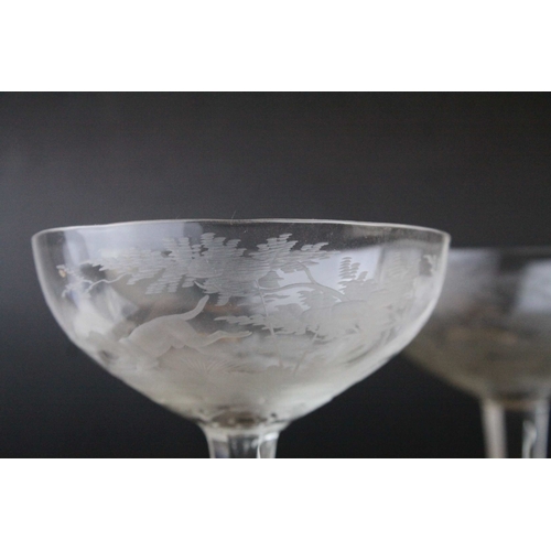 128 - Five Glass Champagne Coups / Cups, each bowl etched with a scene of Stags in Woodland, 18cms high