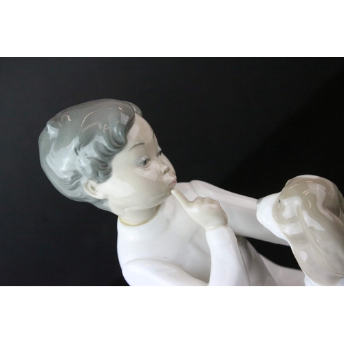 129 - Four Lladro Figures including ' Shh Quiet Puppy ' model no. 4522 and Three Angel Figures