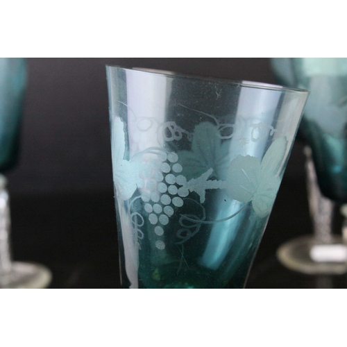 130 - Set of Four Blue Wine Goblets, etched with grapes and vines, raised on clear air twist stems, 20cms ... 