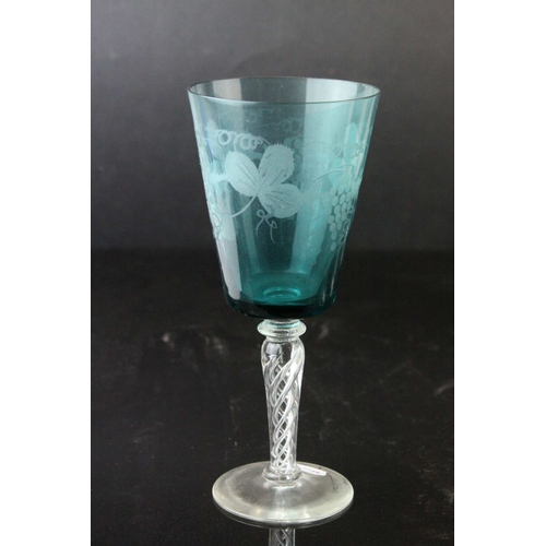 130 - Set of Four Blue Wine Goblets, etched with grapes and vines, raised on clear air twist stems, 20cms ... 