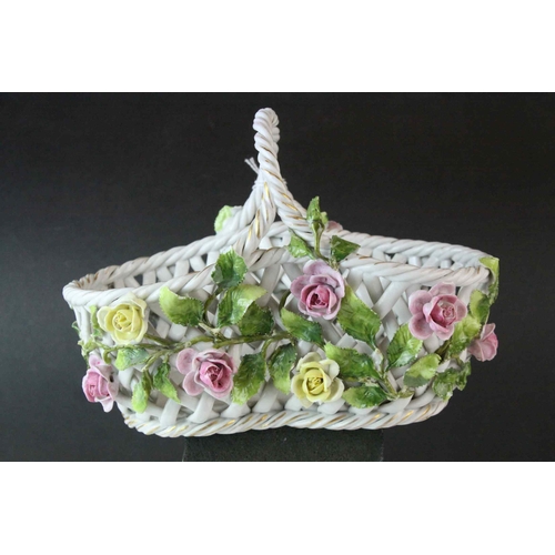 15 - German Von Schierholz Porcelain Pierced Basket decorated with encrusted flowers, 21cms long